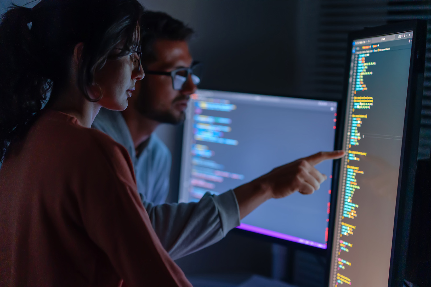 Developers reviewing code together